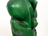 sculpture of a green sculpture on a white pedestal against a white background