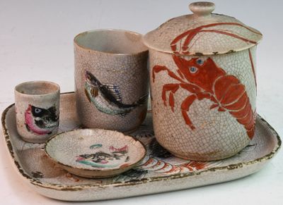a picture of a tray with a plate, cups, and a teapot