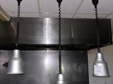 three lights hanging from the ceiling in a kitchen