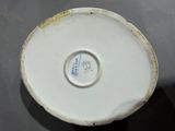 a white plate with a blue and white design on it