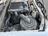 a car engine that is sitting in the trunk of a car