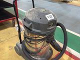 a vacuum that is sitting on the floor in the room