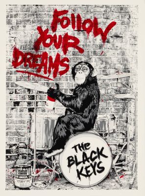 un dessin en noir et blanc représentant un singe assis sur un tambour