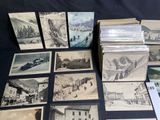a lot of old postcards that are on a table