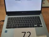 a laptop that is sitting on a table with a price tag on it