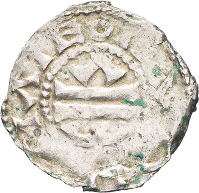 a close up of a silver coin with a crown on it