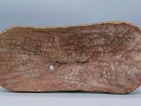 an image of a close up of a wooden object on a white surface