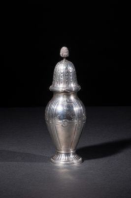 an image of a silver vase with a lid on a table