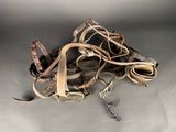 a pile of leather and metal items on a table