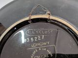 a close up of a black pot with a label on it