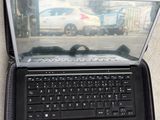 a laptop that is open on the ground