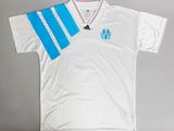 the shirt is white with blue stripes on it