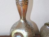 two vases that are sitting on a table