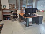a desk with two computer monitors on it in a room