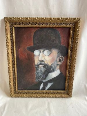 tableau représentant un homme portant un chapeau et des lunettes, dans un cadre doré