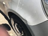 a close up of a car ' s tire on the street