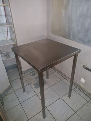 a small table that is in the corner of a room