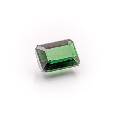 a green tourmaline gems on a white background
