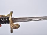 a person holding a sword in their hand on a white background