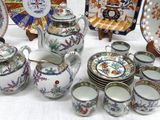 a table with a lot of different plates and cups on it