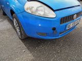 a picture of a blue car that is parked in a parking lot