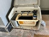 a dirty toilet with a bottle of beer in it