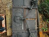 an old iron door on the side of a building