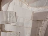 a close up of a piece of clothing with tags attached to it
