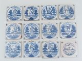 several blue and white tiles with images of people and animals on them