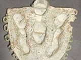 an image of a statue of a man on a shield