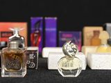 many different types of perfumes on the table