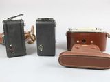 three pieces of luggage sitting next to each other on a white surface