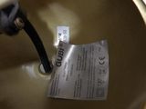 a close up of a metal bowl with a label on it
