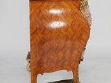 a small wooden cabinet on wheels with a marble top