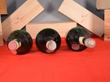 three bottles of wine sitting next to each other on a table