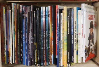 many books in a box on the shelf