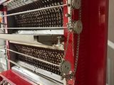 an image of a red machine that is sitting in a room