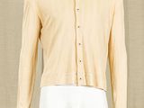 an image of a mannequin wearing a yellow shirt and white pants