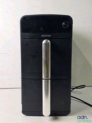 an image of a black and silver refrigerator with a silver handle