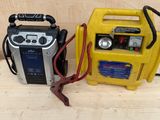 two batteries and a radio sitting on a bench