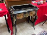 a small table with a red table cloth on it
