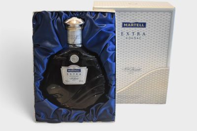 a close up of a bottle of liquor in a box