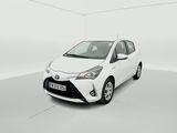 a white toyota yaris parked in a white room