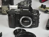 a camera that is sitting on a table next to other cameras