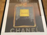 chanel no 5 framed art print in a black frame
