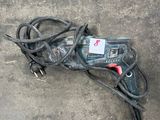 a cord cord and a cord cutter on the ground