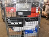a metal cart with many boxes on it in a warehouse