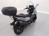 a motorcycle that is parked in a room with white walls