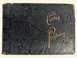 an old book with writing on it sitting on top of a table