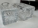 three pieces of glass sitting on a white table
